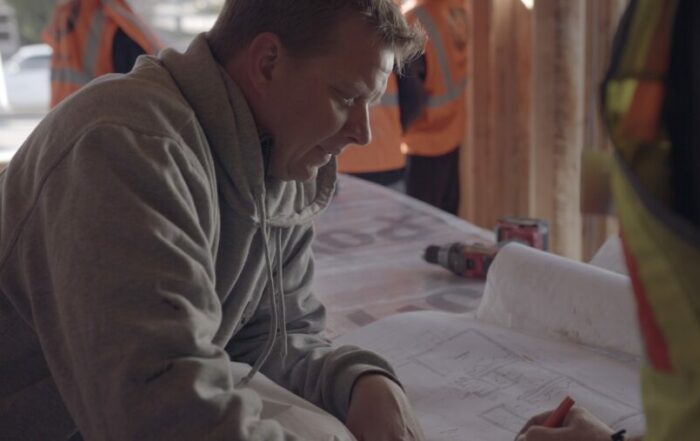 man reviewing blueprints